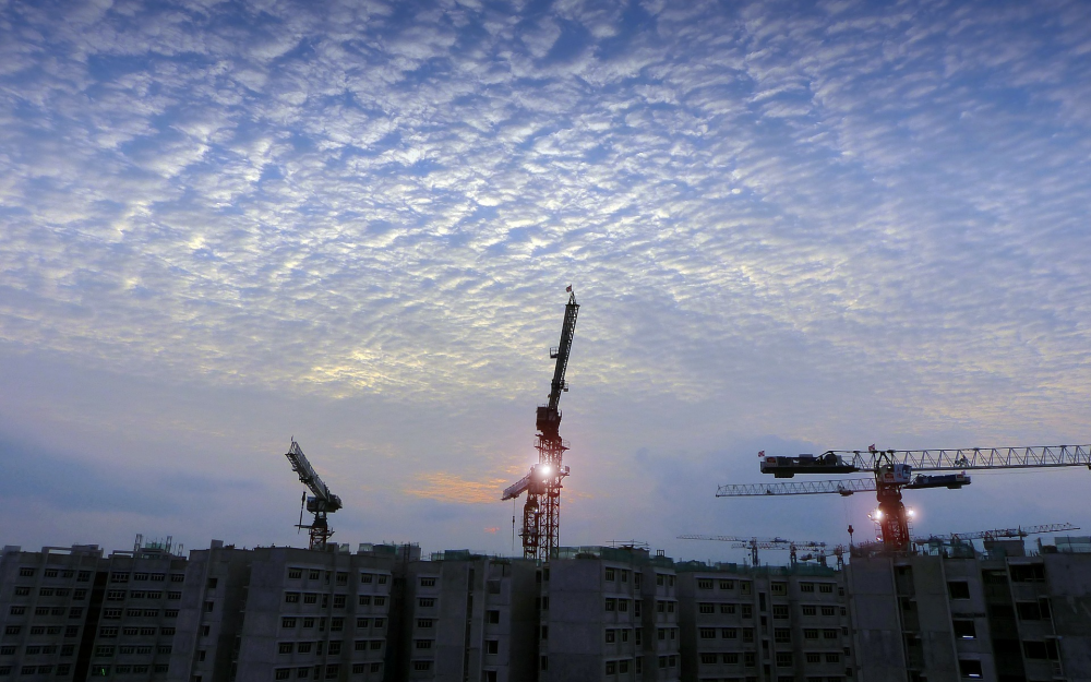 construction background cranes over buildings