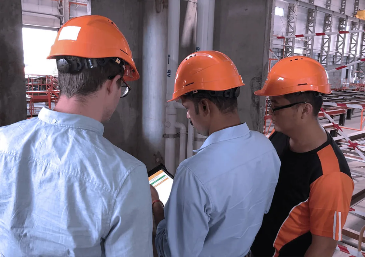 Field technicians using the Novade construction field management software on tablet