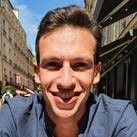 Novade team member smiling outdoors in city setting