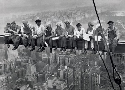 men sitting on crane high rise_lunch atop a crane