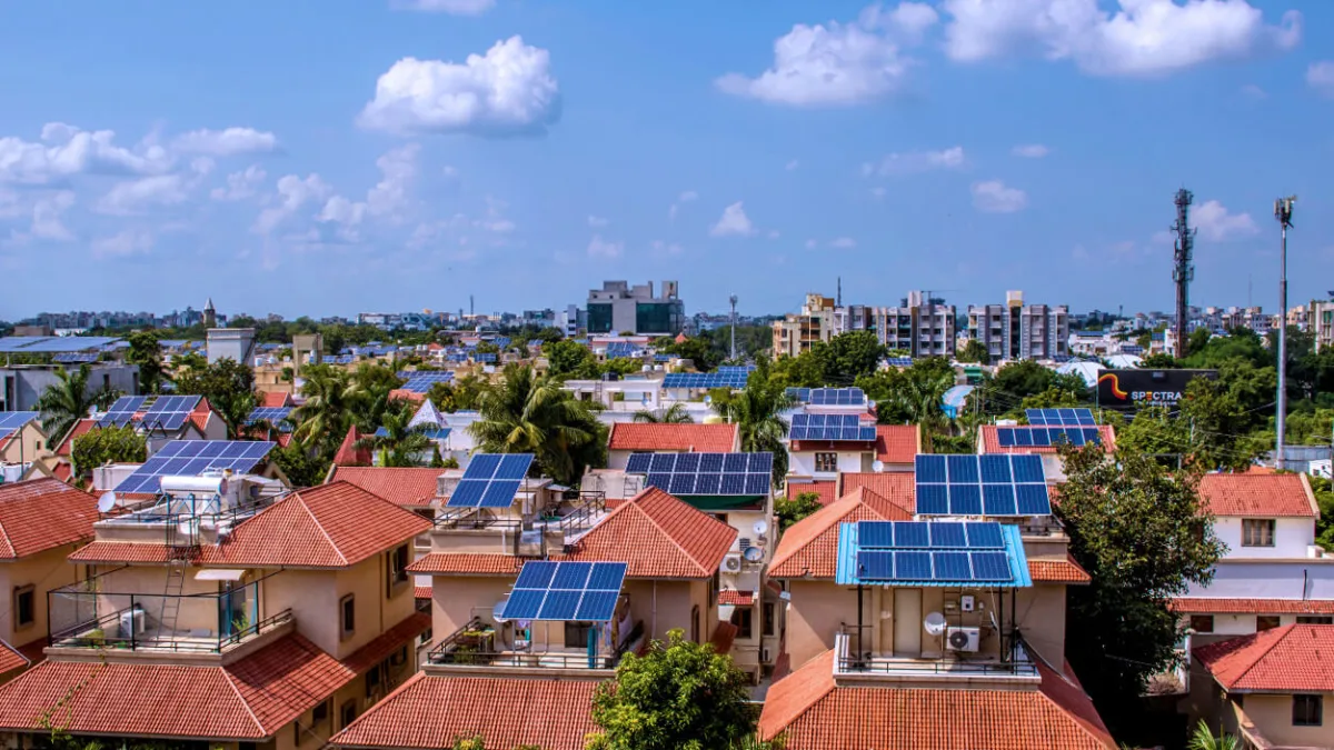 Aerial view of solar panel installations on residential buildings