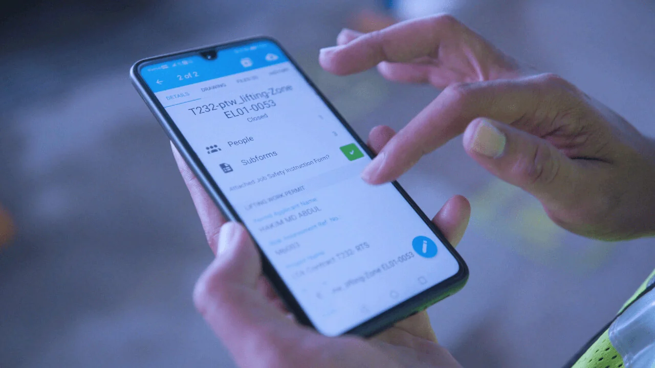 Worker managing permit-to-work safety inspection using Novade mobile app