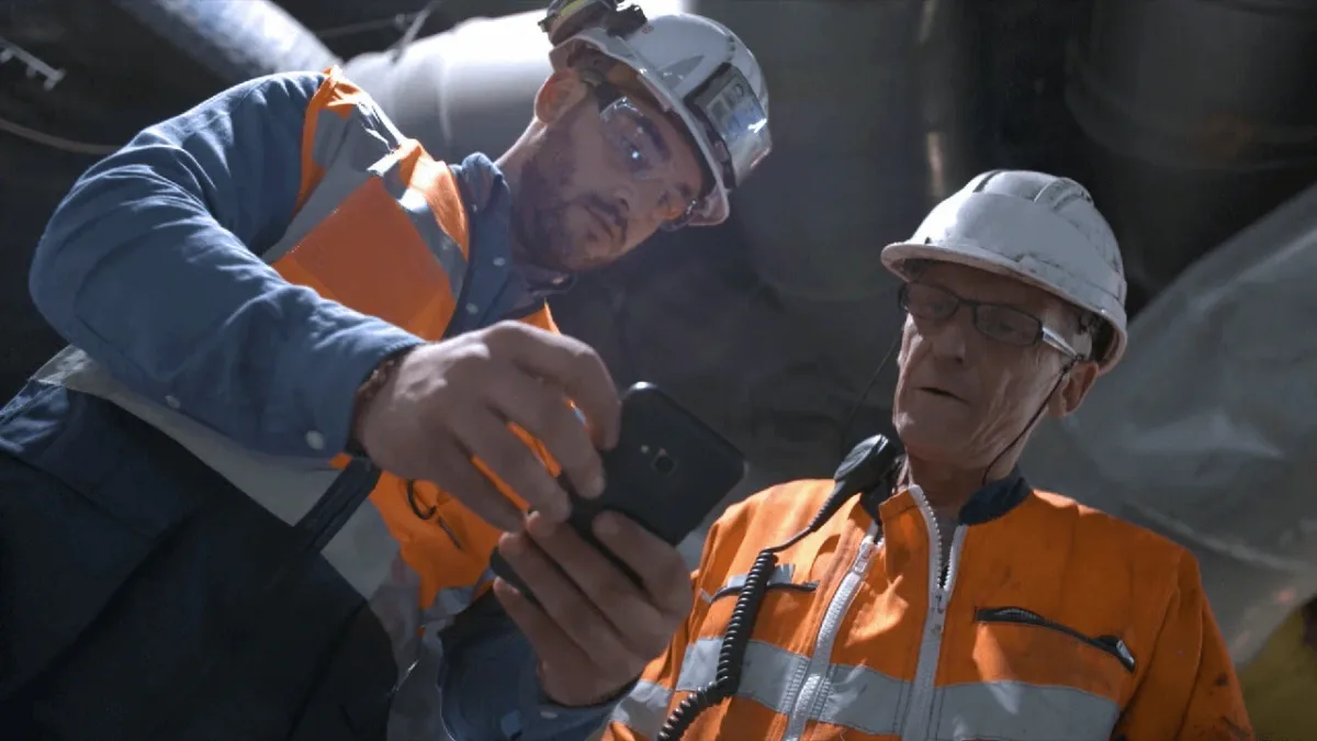 Site supervisors reviewing construction safety and compliance reports