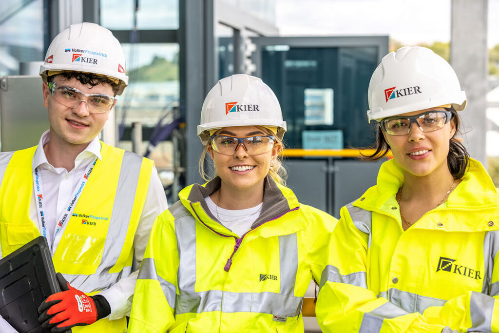 Kier Group construction team in safety gear on active building site