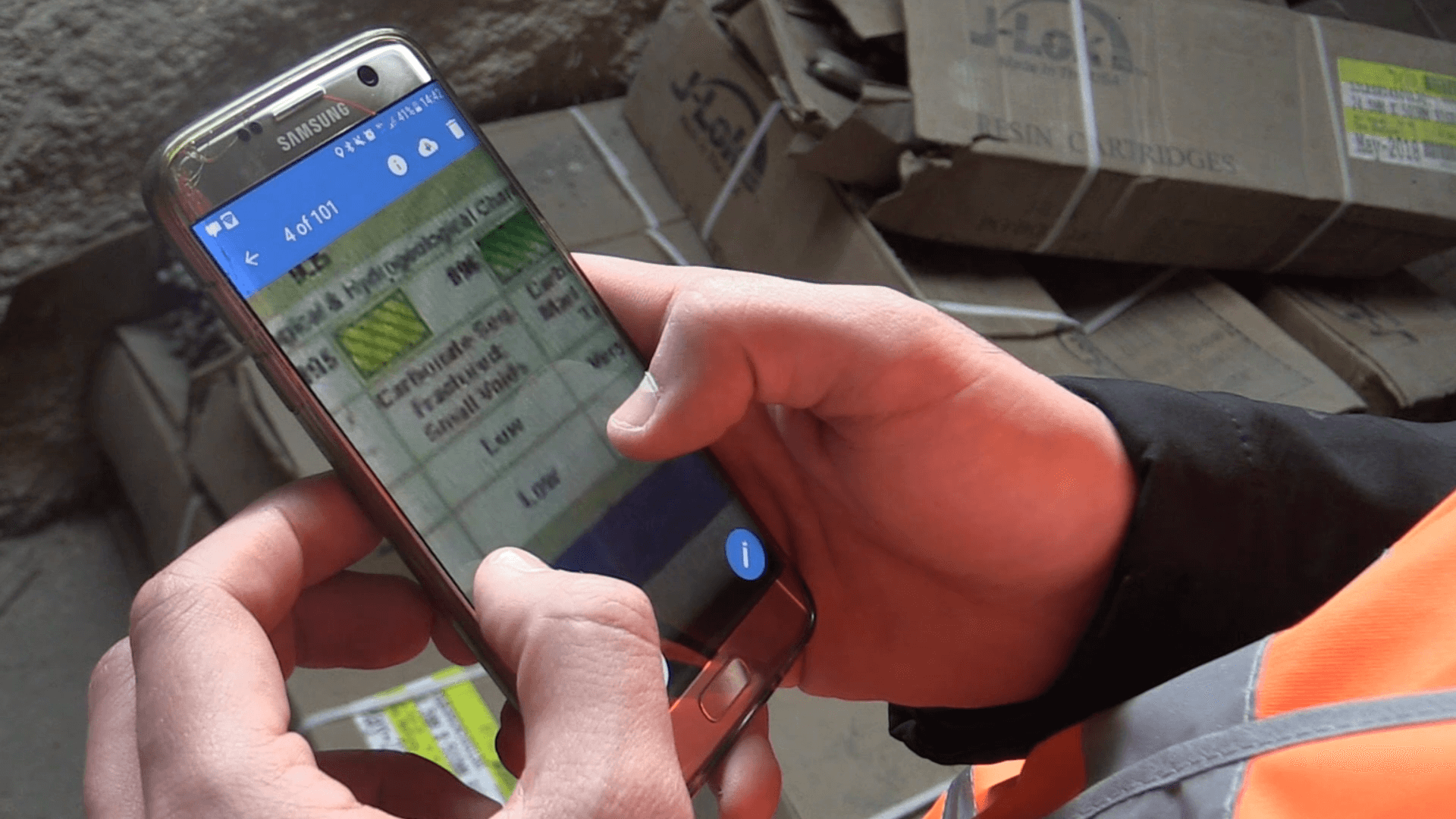 Construction worker using Novade mobile app for tunnel site management